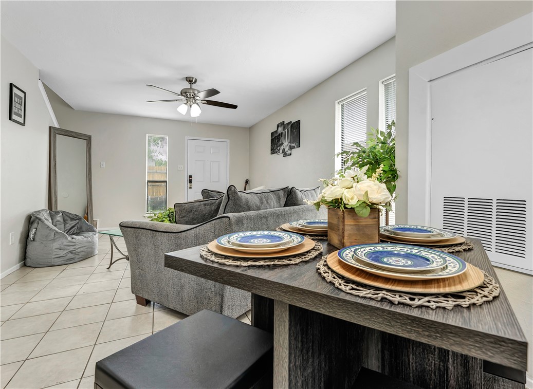 1516 Hawk Tree Drive, Unit C College Station, TX 77845 - Photo 5 of 15 a dining room with furniture and a potted plant