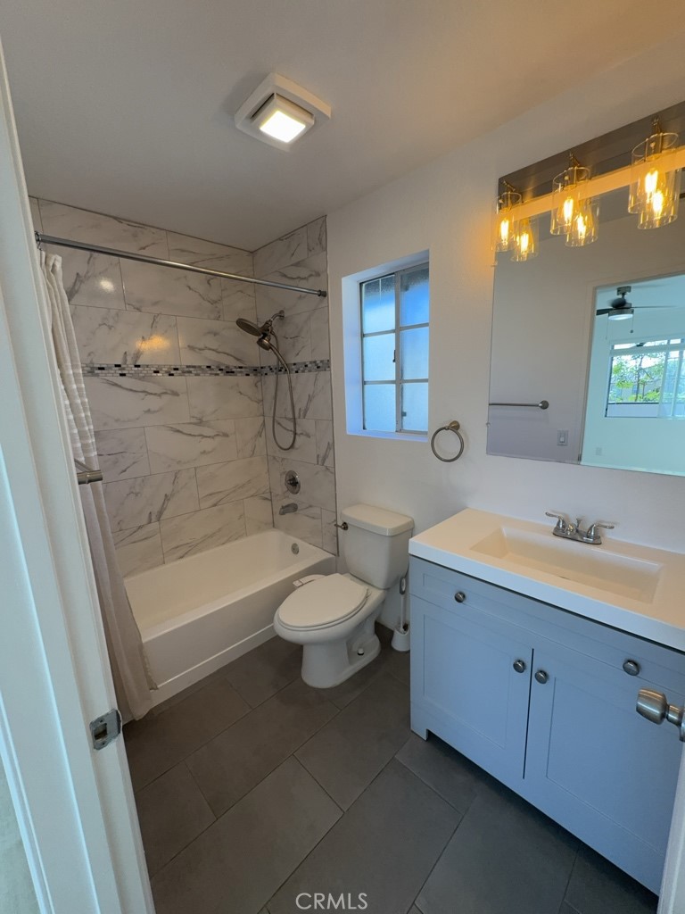 12584 Atwood Court, Unit 1023 Rancho Cucamonga, CA 91739 - Photo 13 of 19 a bathroom with a sink a toilet and bathtub