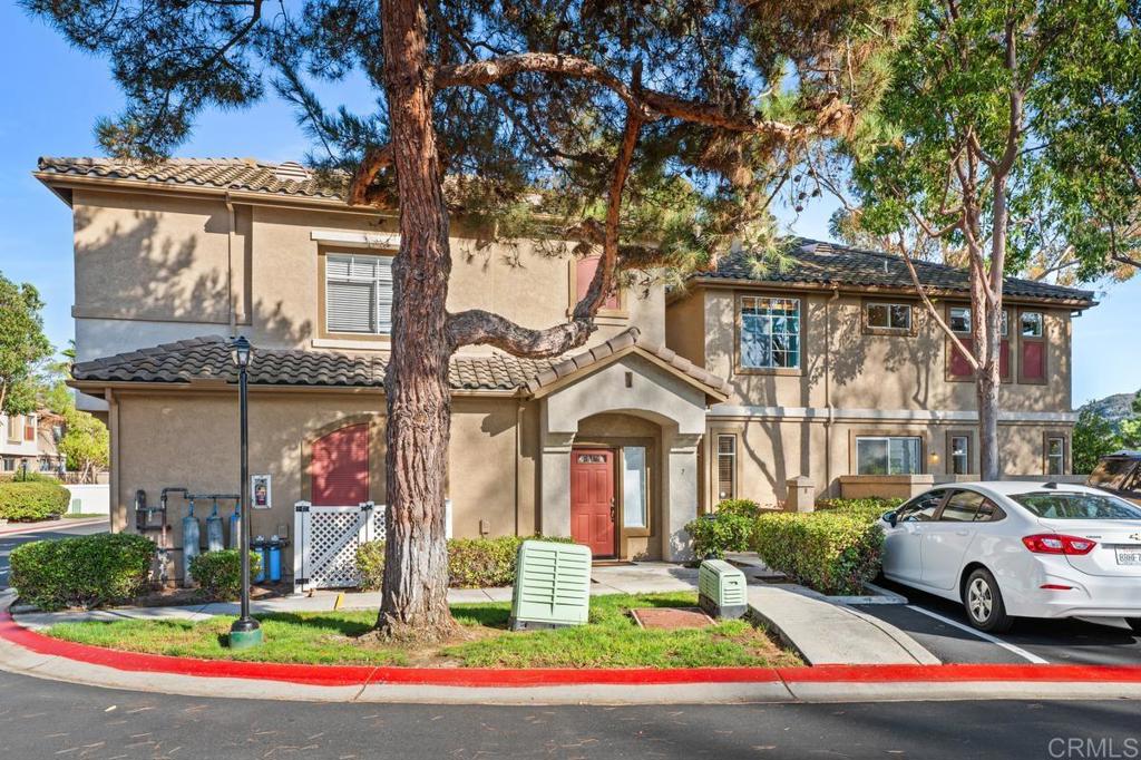 12490 Heatherton Court, Unit 8 San Diego, CA 92128 - Photo 1 of 30 a view of multiple houses with a yard