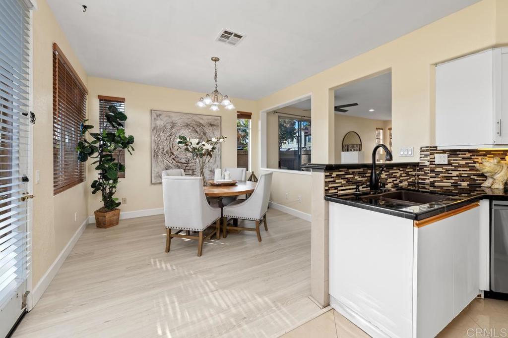 12490 Heatherton Court, Unit 8 San Diego, CA 92128 - Photo 15 of 30 a view of a living room and dining room