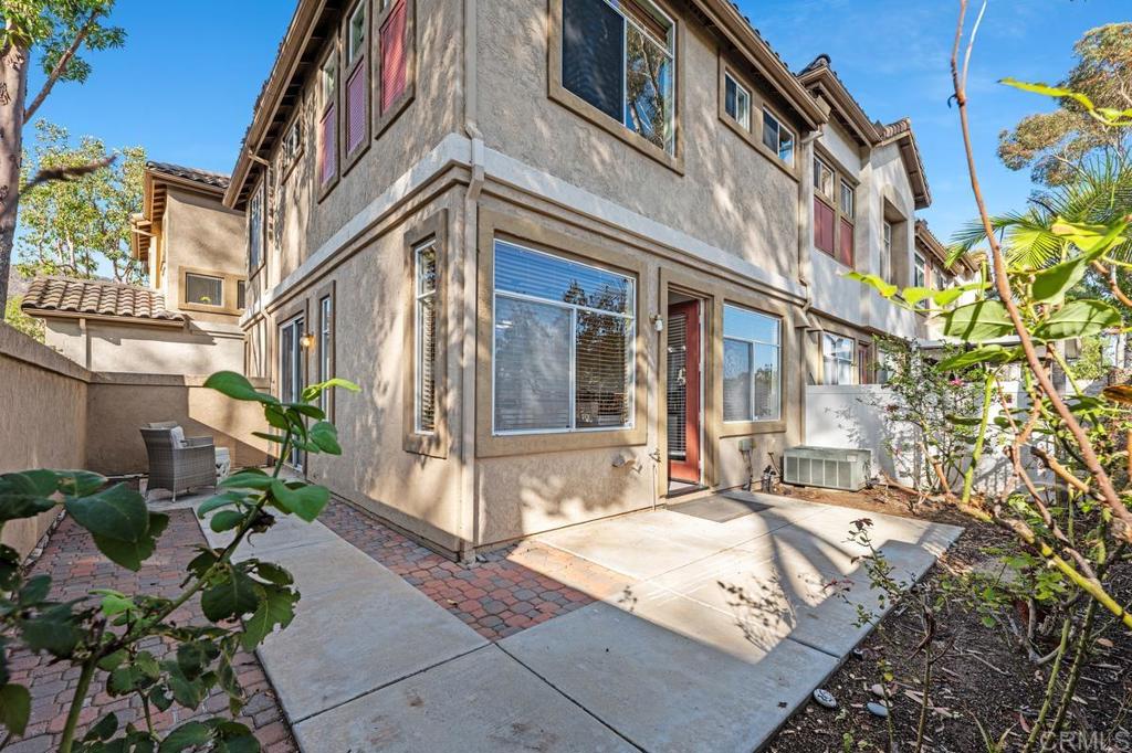 12490 Heatherton Court, Unit 8 San Diego, CA 92128 - Photo 17 of 30 a view of a building with a large tree
