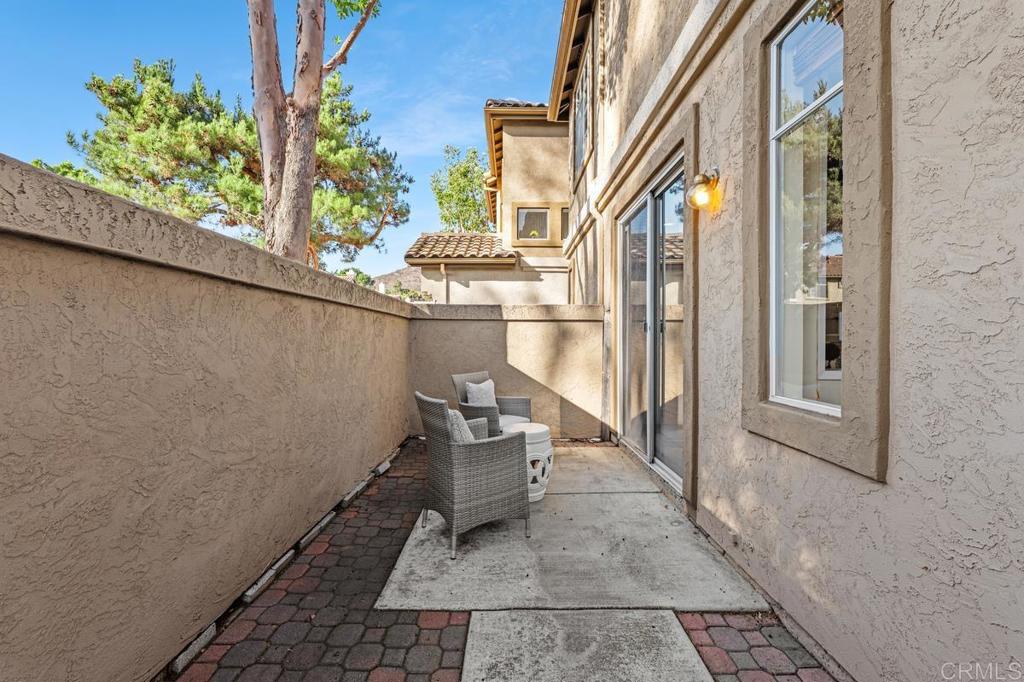 12490 Heatherton Court, Unit 8 San Diego, CA 92128 - Photo 18 of 30 a view of a balcony with wooden floor and furniture
