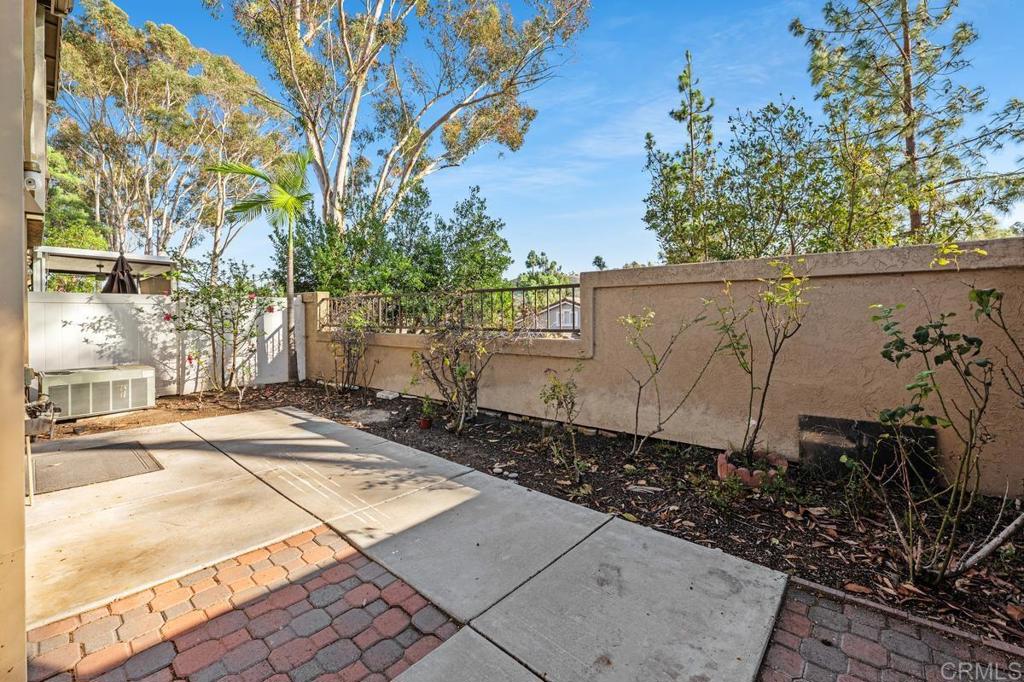 12490 Heatherton Court, Unit 8 San Diego, CA 92128 - Photo 20 of 30 front view of a house with a street