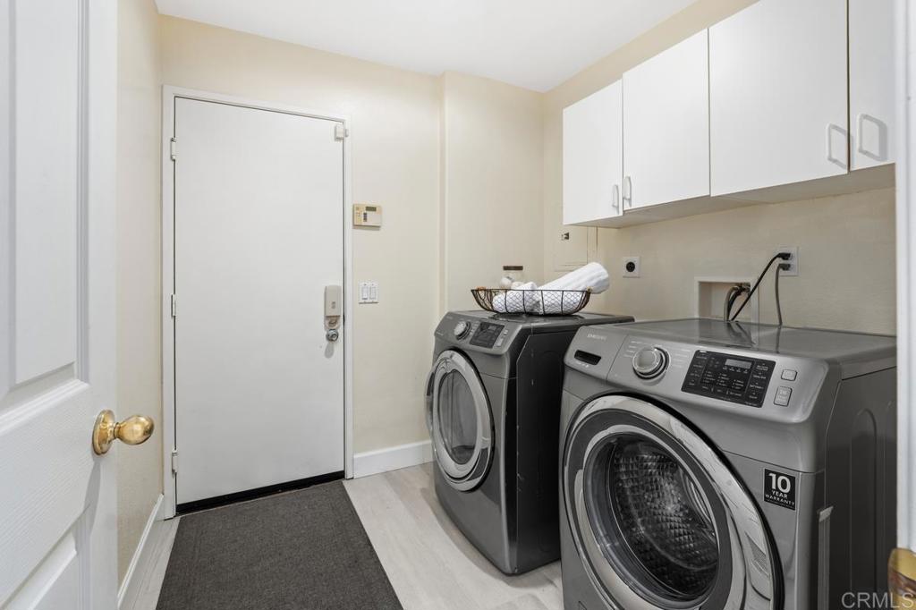12490 Heatherton Court, Unit 8 San Diego, CA 92128 - Photo 21 of 30 a utility room with dryer and washer