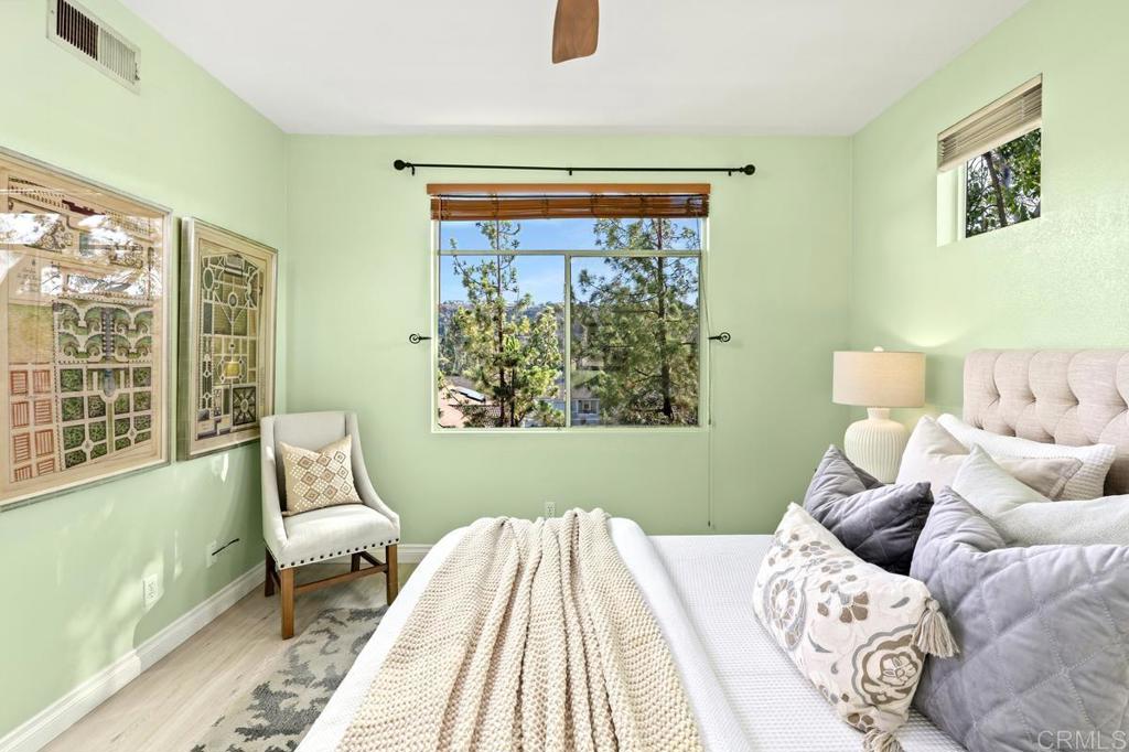 12490 Heatherton Court, Unit 8 San Diego, CA 92128 - Photo 25 of 30 a bedroom with a bed and a window