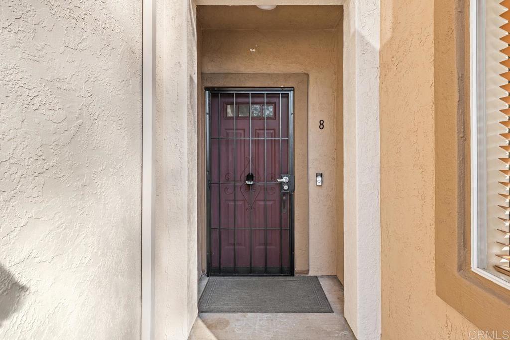 12490 Heatherton Court, Unit 8 San Diego, CA 92128 - Photo 5 of 30 a view of a hallway with wooden floor