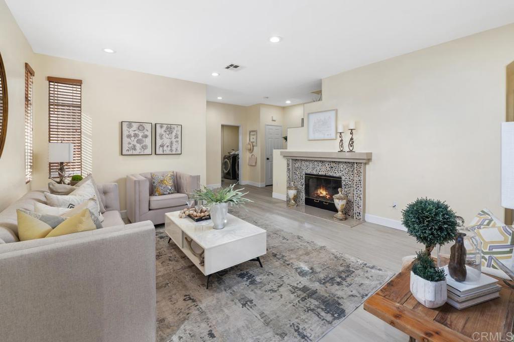 12490 Heatherton Court, Unit 8 San Diego, CA 92128 - Photo 9 of 30 a living room with furniture and a fireplace