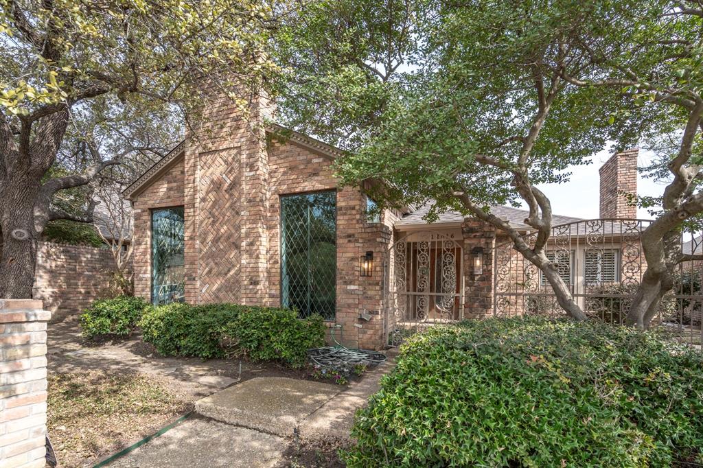 12616 Sunlight Drive Dallas, TX 75230 - Photo 2 of 40 a front view of a house with garden