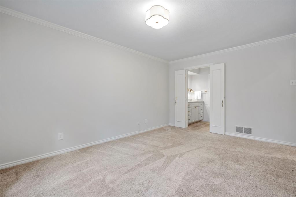 12616 Sunlight Drive Dallas, TX 75230 - Photo 28 of 40 an empty room with an entryway