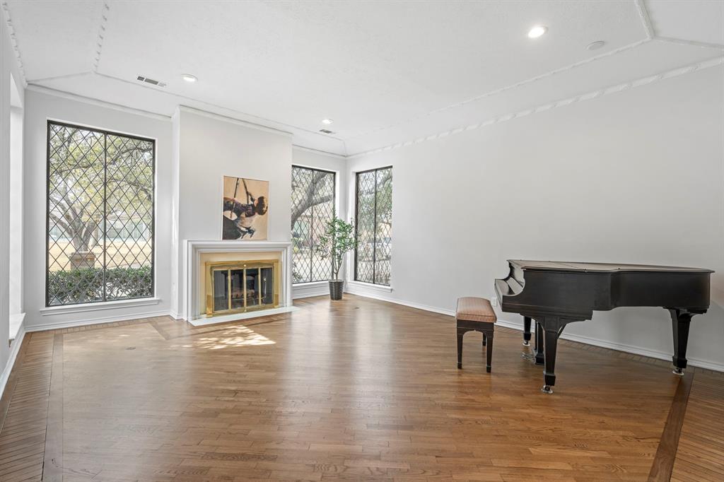 12616 Sunlight Drive Dallas, TX 75230 - Photo 4 of 40 a view of a livingroom with furniture window and wooden floor