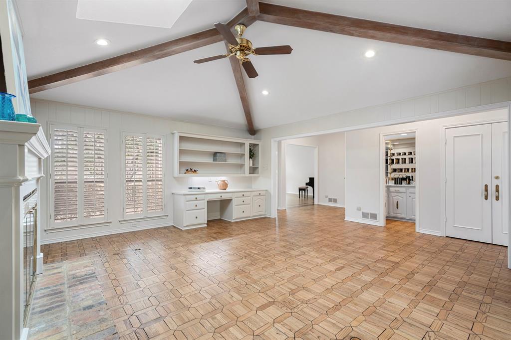 12616 Sunlight Drive Dallas, TX 75230 - Photo 8 of 40 a view of a kitchen with refrigerator and more cabinets