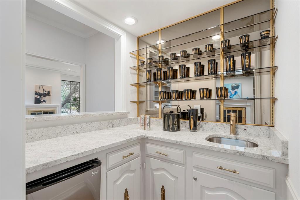 12616 Sunlight Drive Dallas, TX 75230 - Photo 9 of 40 a kitchen with refrigerator and cabinets