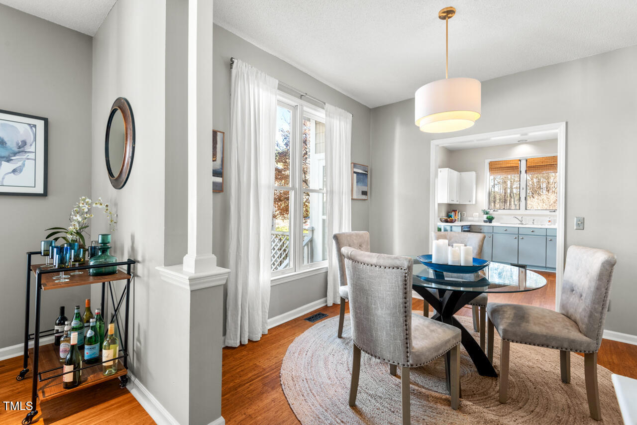 125 Legacy Lane Durham, NC 27713 - Photo 12 of 37 a view of a dining room with furniture window and wooden floor
