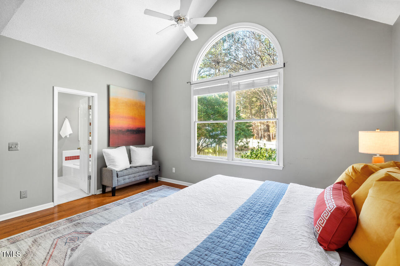 125 Legacy Lane Durham, NC 27713 - Photo 15 of 37 a bed sitting in a bedroom next to a window