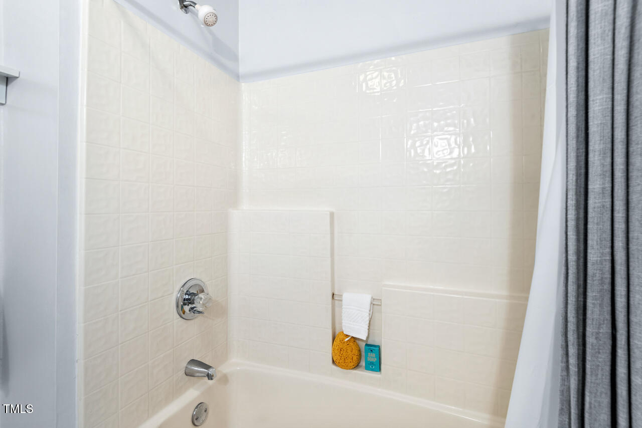 125 Legacy Lane Durham, NC 27713 - Photo 26 of 37 a bathroom with a bathtub