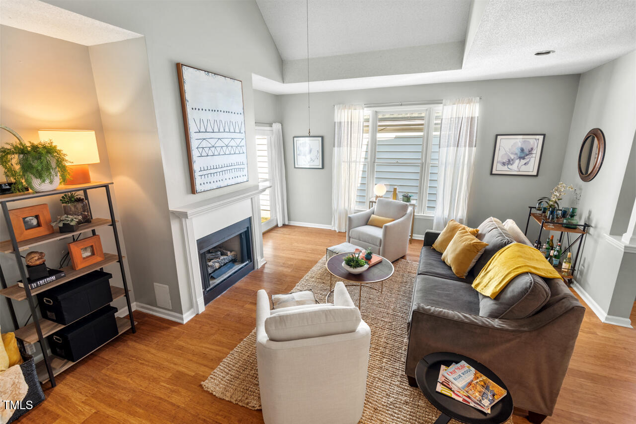125 Legacy Lane Durham, NC 27713 - Photo 4 of 37 a living room with furniture and a fireplace