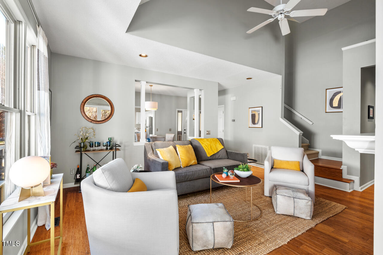 125 Legacy Lane Durham, NC 27713 - Photo 5 of 37 a living room with furniture a clock and a window