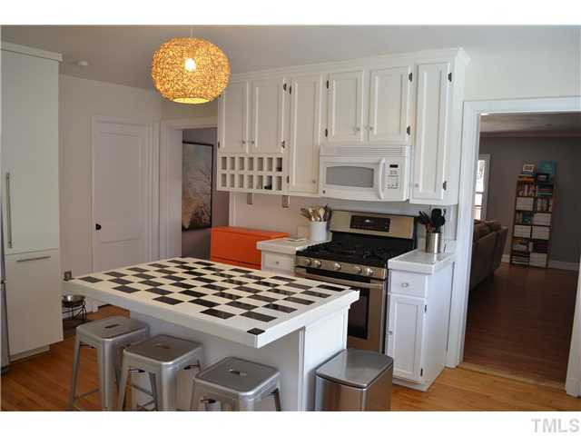 309 Glascock Street Raleigh, NC 27604 - Photo 8 of 23 extra large cooks kitchen complete with center island, newer gas range, built in cubbies and plenty of cabinet space