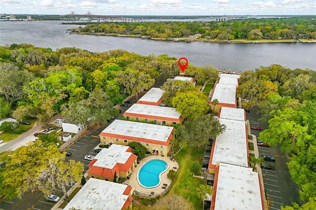 an aerial view of a house with a lake view