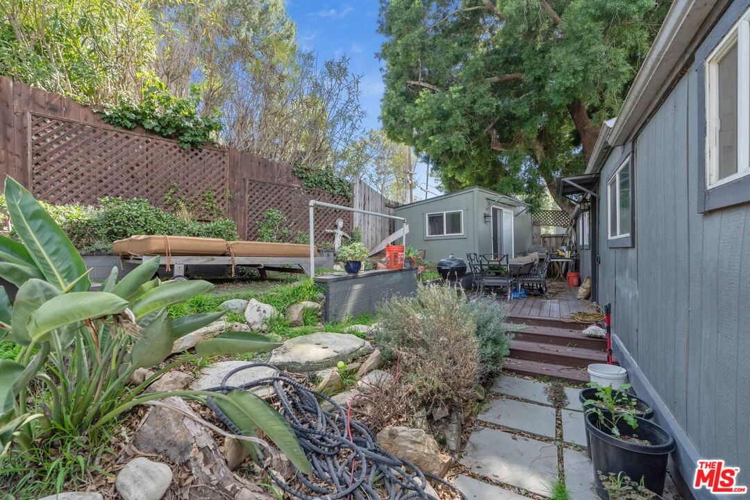 2 Paradise Cove Road Malibu, CA 90265 - Photo 12 of 24 a front view of a house with a yard garden