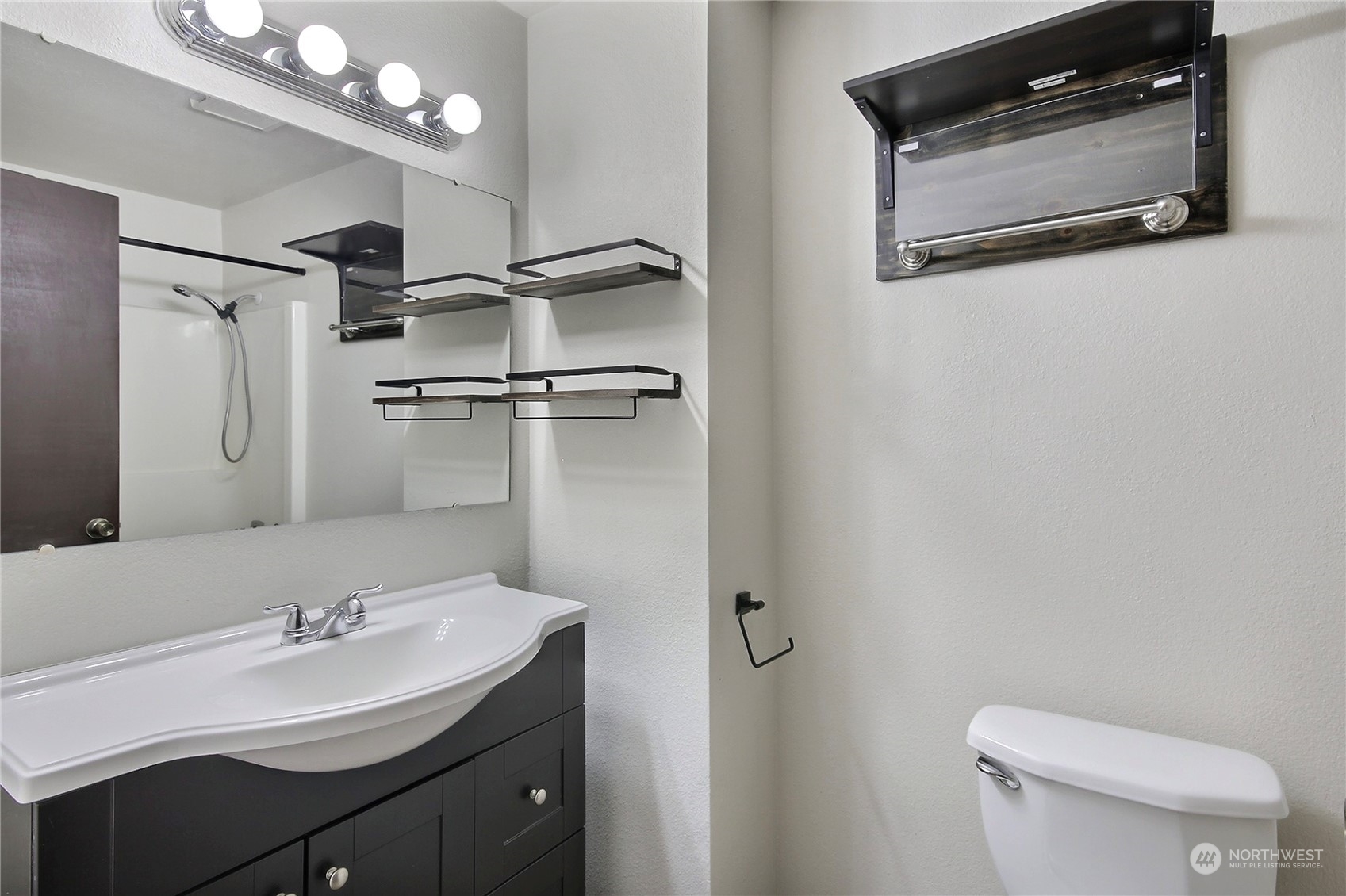 818 Haskell Street DuPont, WA 98327 - Photo 14 of 26 a bathroom with a sink a toilet and mirror