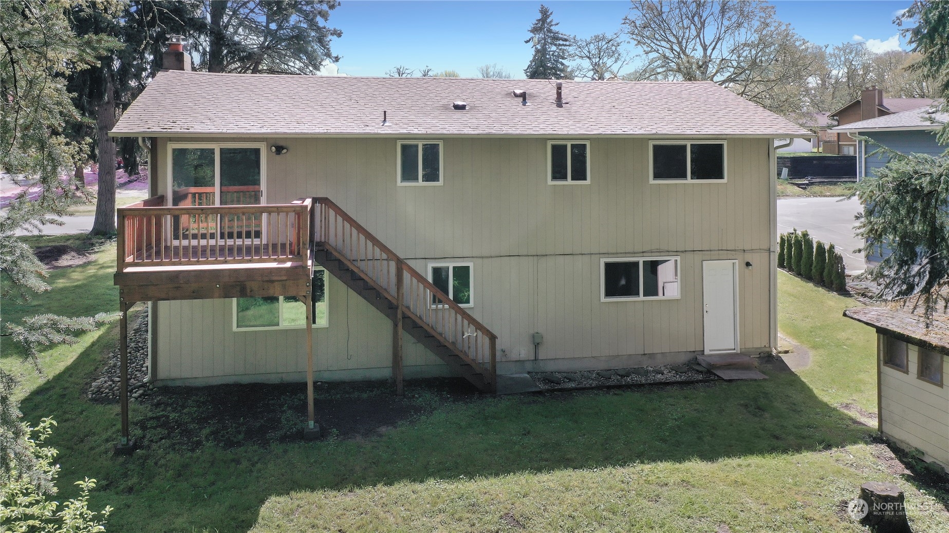 818 Haskell Street DuPont, WA 98327 - Photo 21 of 26 a view of a house with a yard