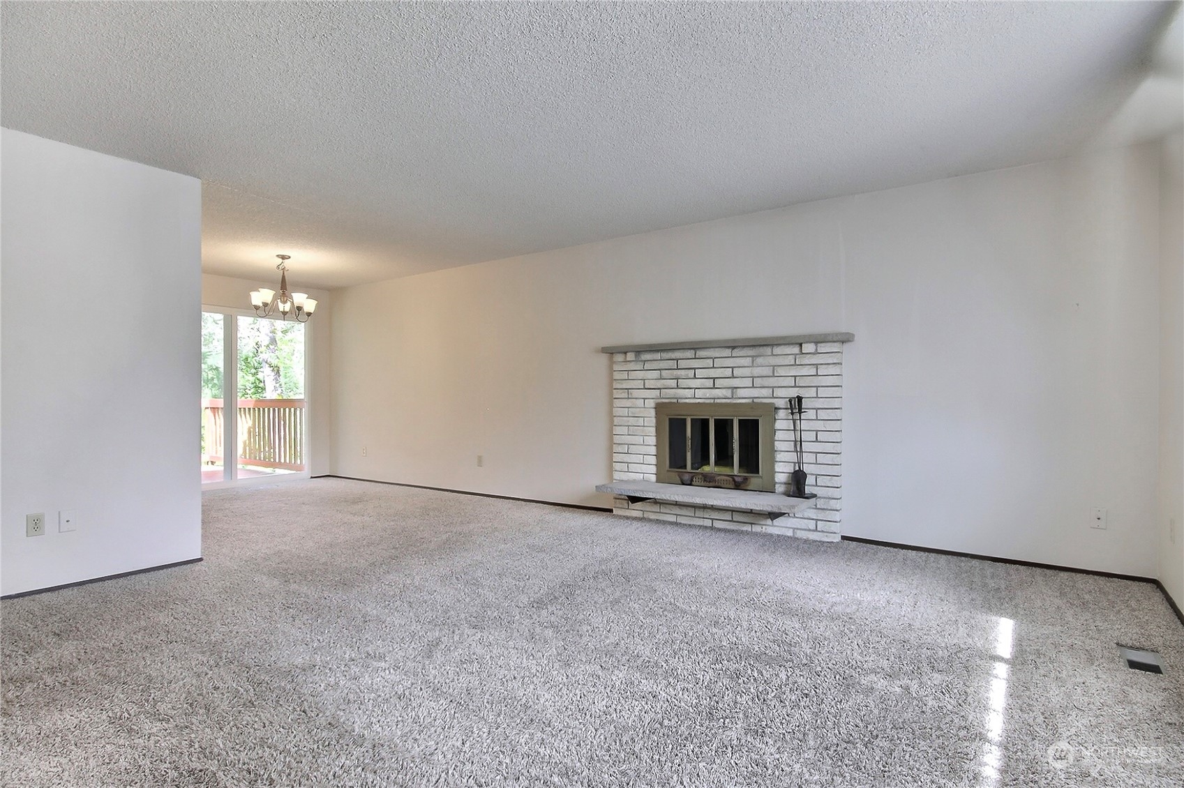 818 Haskell Street DuPont, WA 98327 - Photo 4 of 26 a view of an empty room with a fireplace