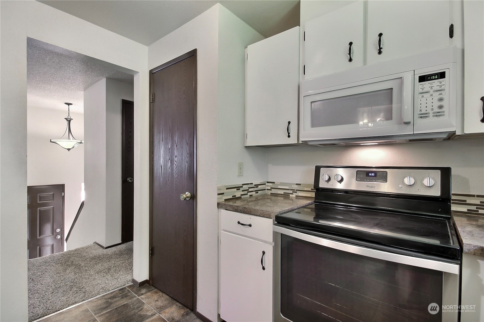 818 Haskell Street DuPont, WA 98327 - Photo 7 of 26 a stove top oven sitting inside of a kitchen