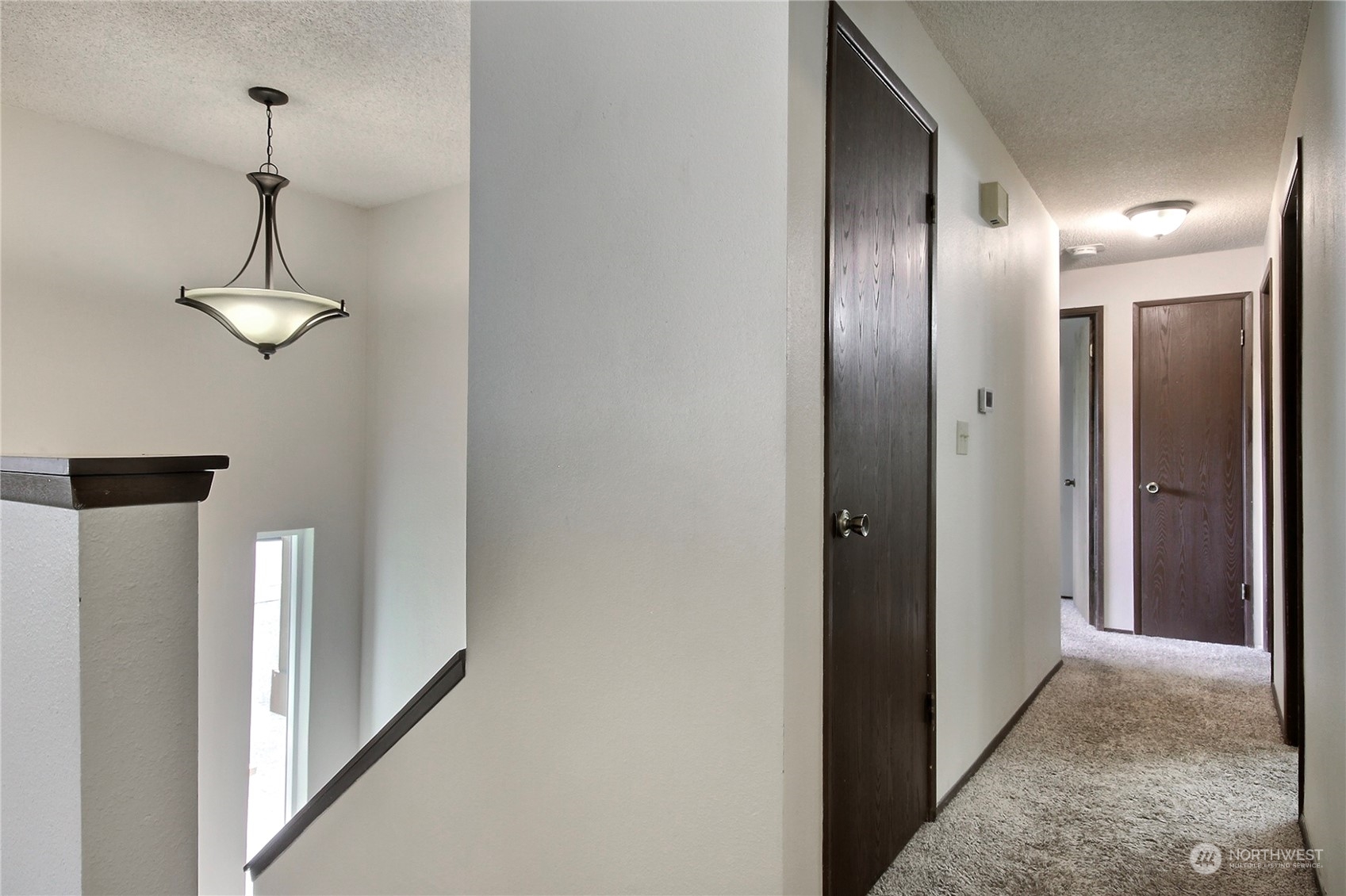 818 Haskell Street DuPont, WA 98327 - Photo 8 of 26 a view of a hallway with chandelier