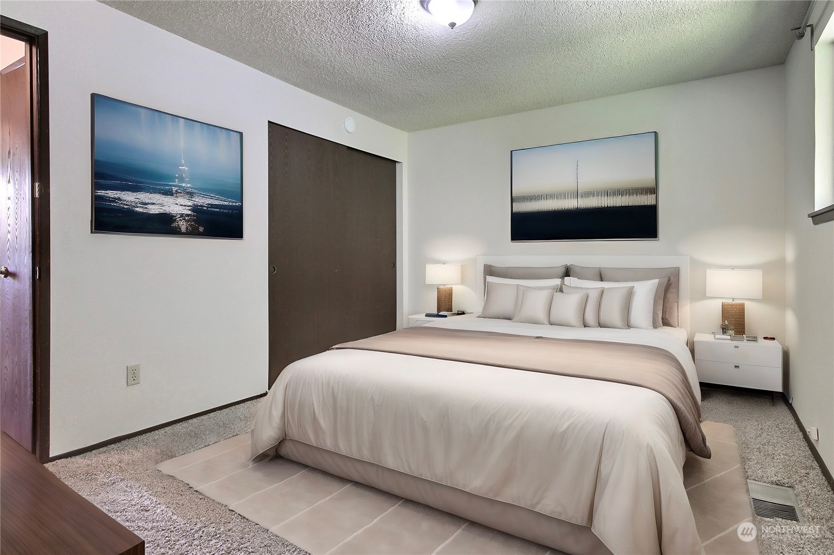 818 Haskell Street DuPont, WA 98327 - Photo 9 of 26 a bedroom with a large bed and a flat screen tv