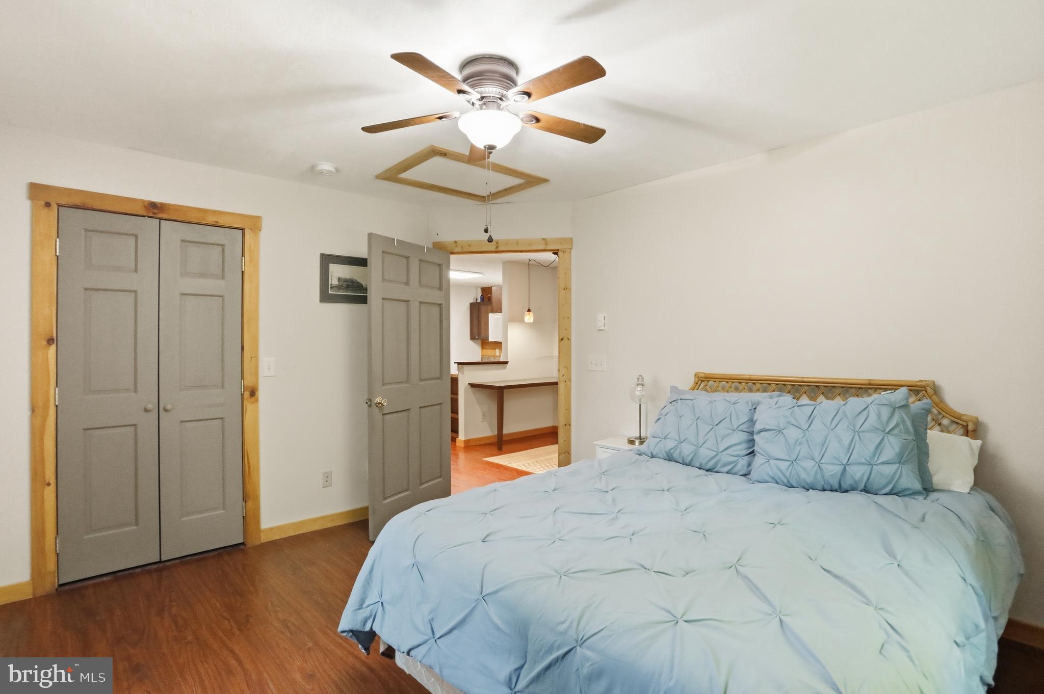 1400 Core Road Romney, WV 26757 - Photo 41 of 73 a bedroom with a bed and a chandelier