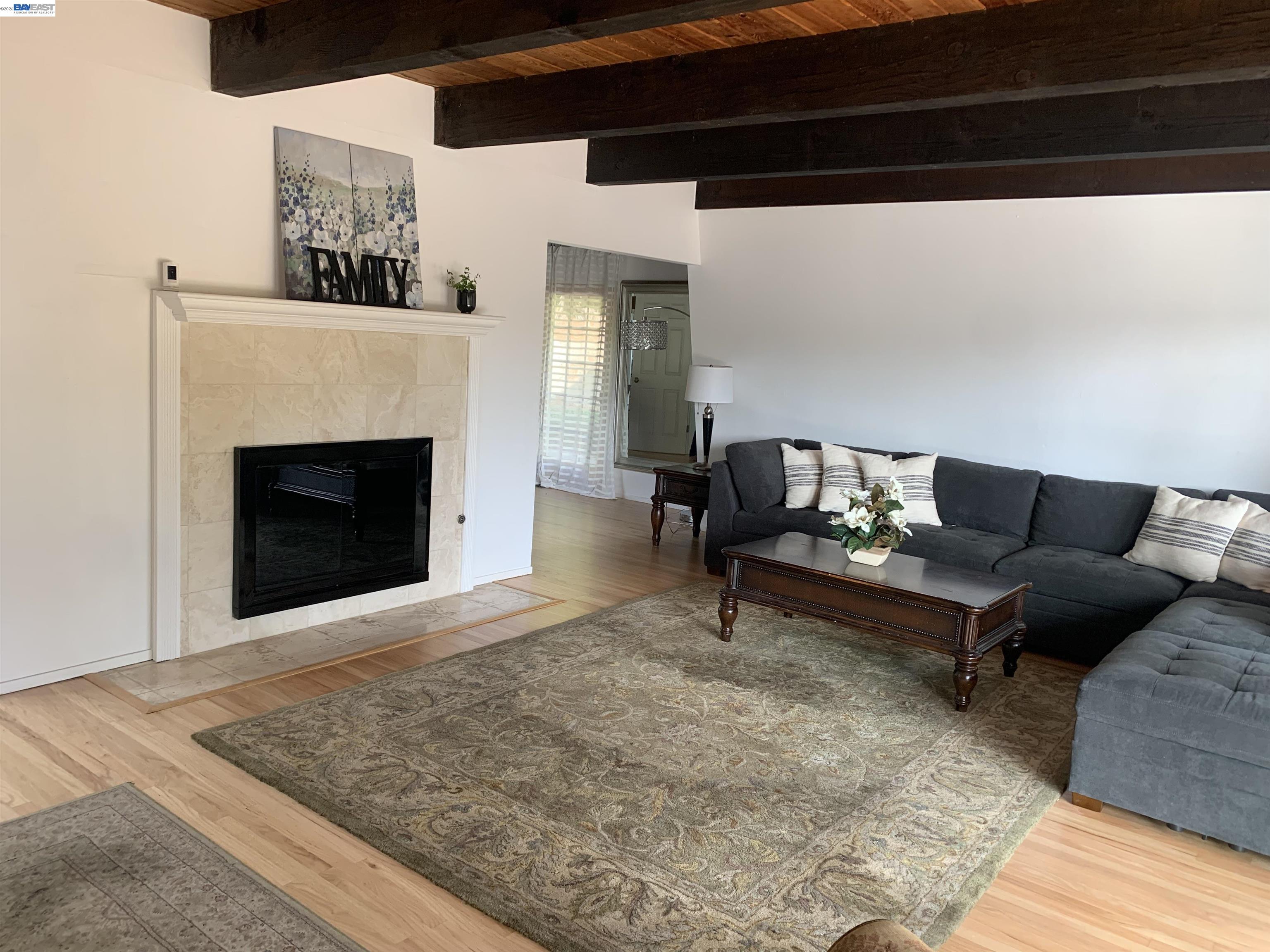 4515 Ewing Road Castro Valley, CA 94546 - Photo 7 of 41 a living room with furniture and a fireplace