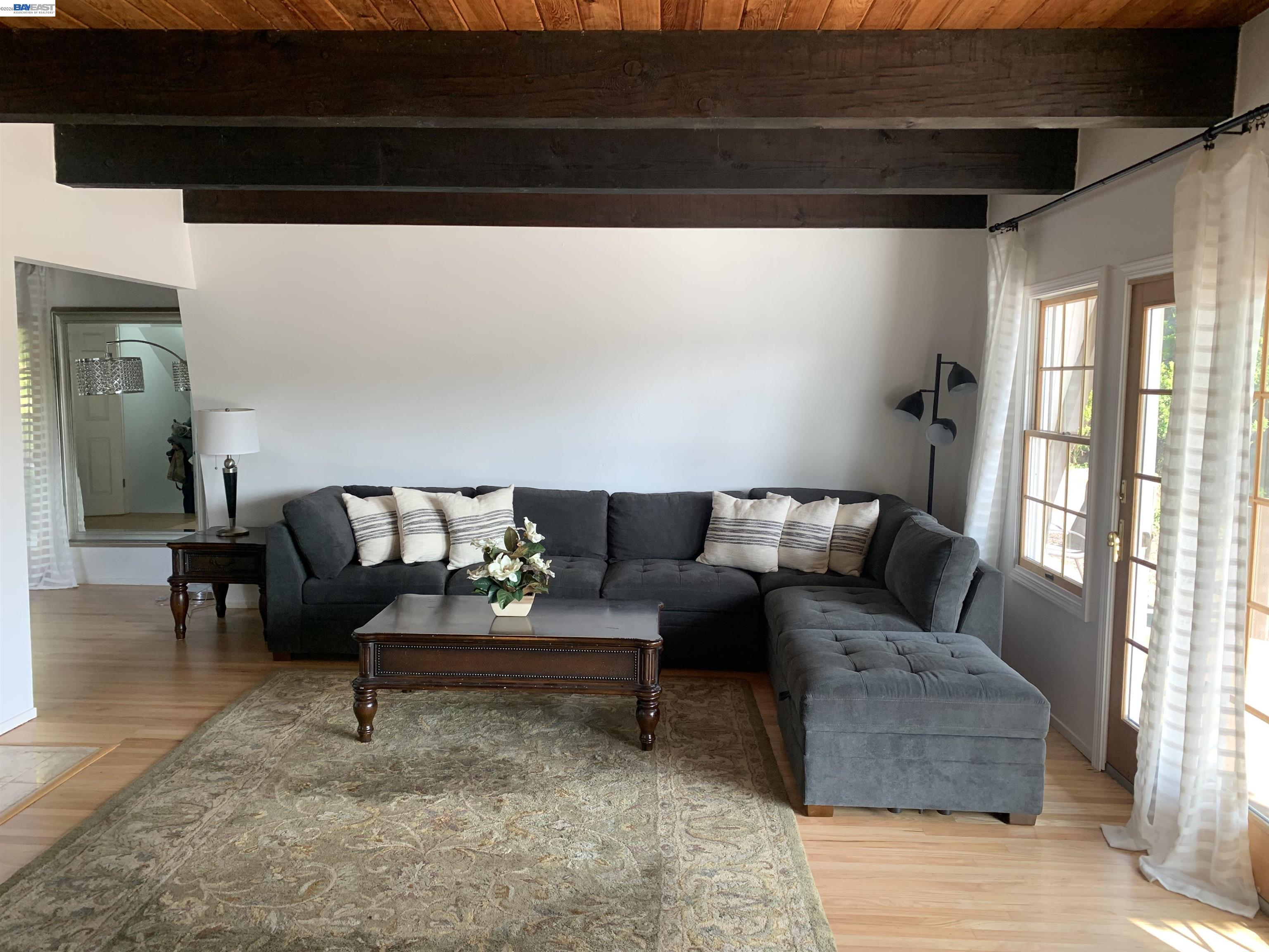 4515 Ewing Road Castro Valley, CA 94546 - Photo 8 of 41 a living room with furniture and a rug