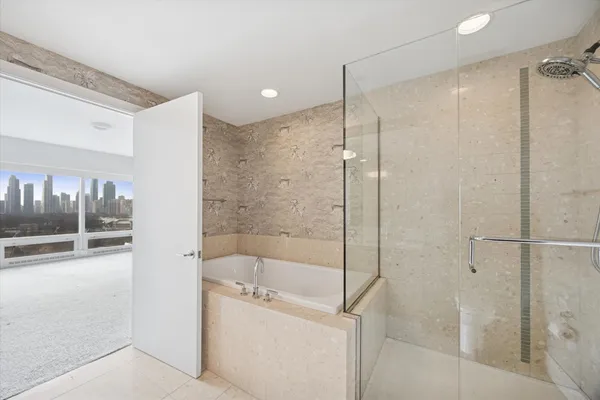 a bathroom with a shower and a sink