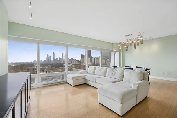 a living room with furniture and a large window