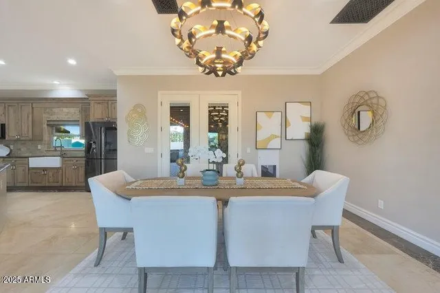 a kitchen with stainless steel appliances kitchen island granite countertop a refrigerator and a sink