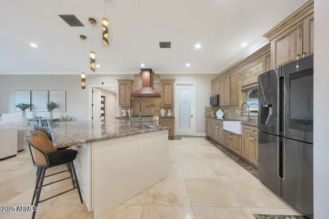 a kitchen with granite countertop a stove and cabinets