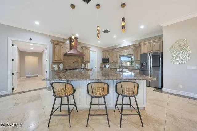 a kitchen with granite countertop white cabinets stainless steel appliances and sink