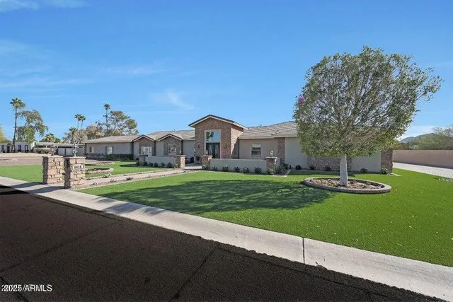 a front view of a house with garden