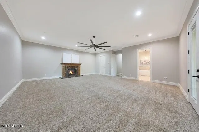 a spacious bathroom with a double vanity sink mirror and bathtub