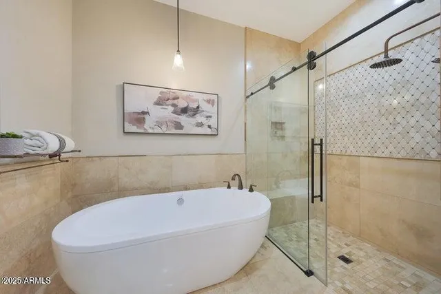 an empty room with fireplace and windows