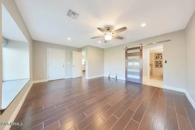 a spacious bathroom with a double vanity sink toilet and shower