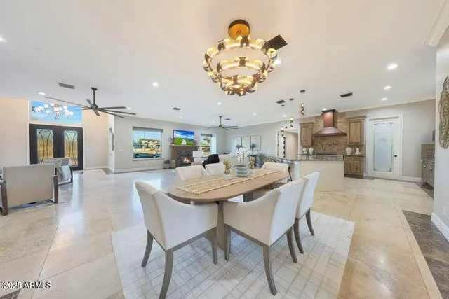 a dining room with a table and chairs