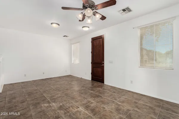 a view of an empty room with a window