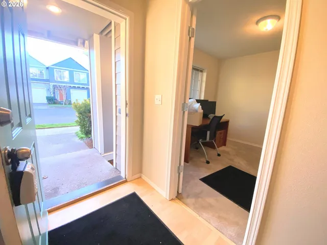 a spacious bathroom with a granite countertop sink and a mirror
