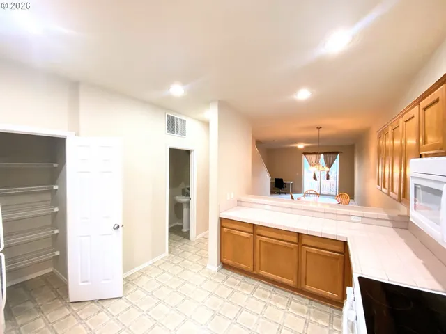 a kitchen with stainless steel appliances granite countertop a sink and cabinets