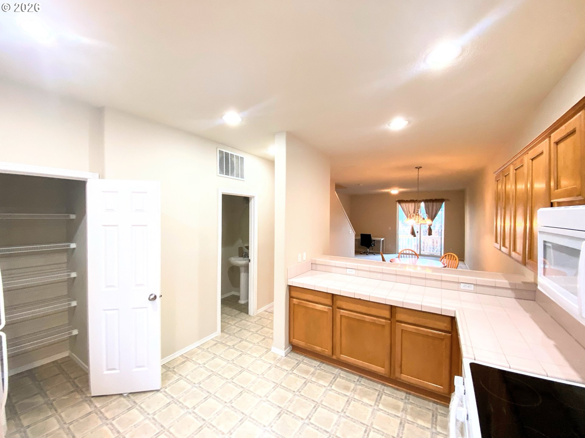 17446 Southwest October Court Beaverton, OR 97003 - Photo 15 of 21 a spacious bathroom with a granite countertop sink and a mirror