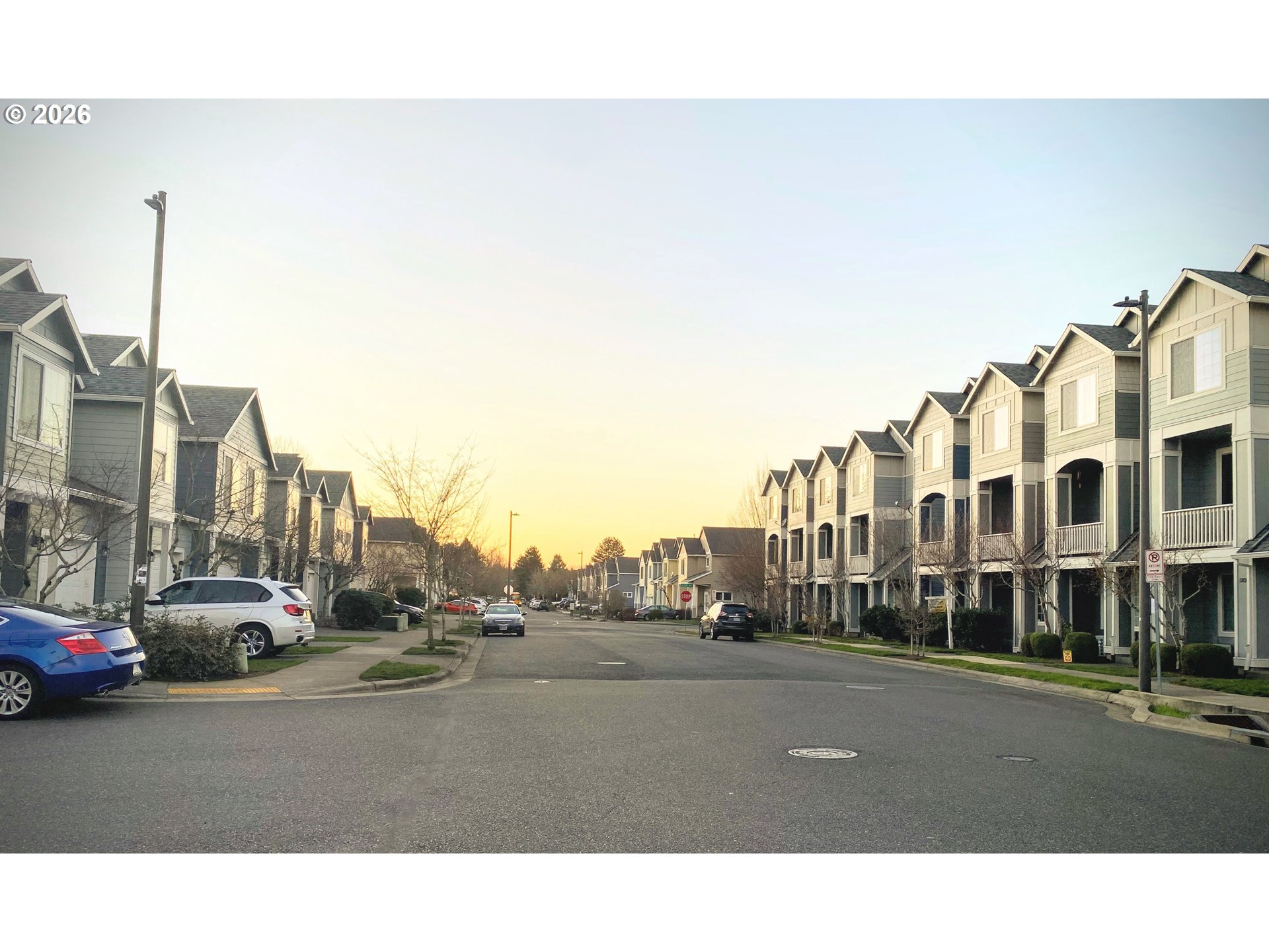 17446 Southwest October Court Beaverton, OR 97003 - Photo 19 of 21 a city street with cars parked in front of it
