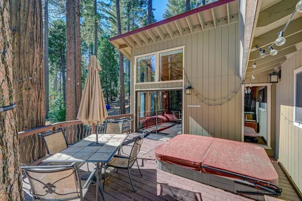 a patio with table and chairs