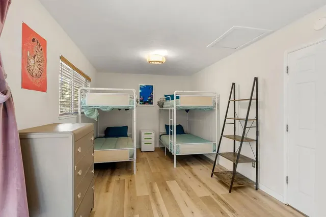 a bedroom with furniture and a window